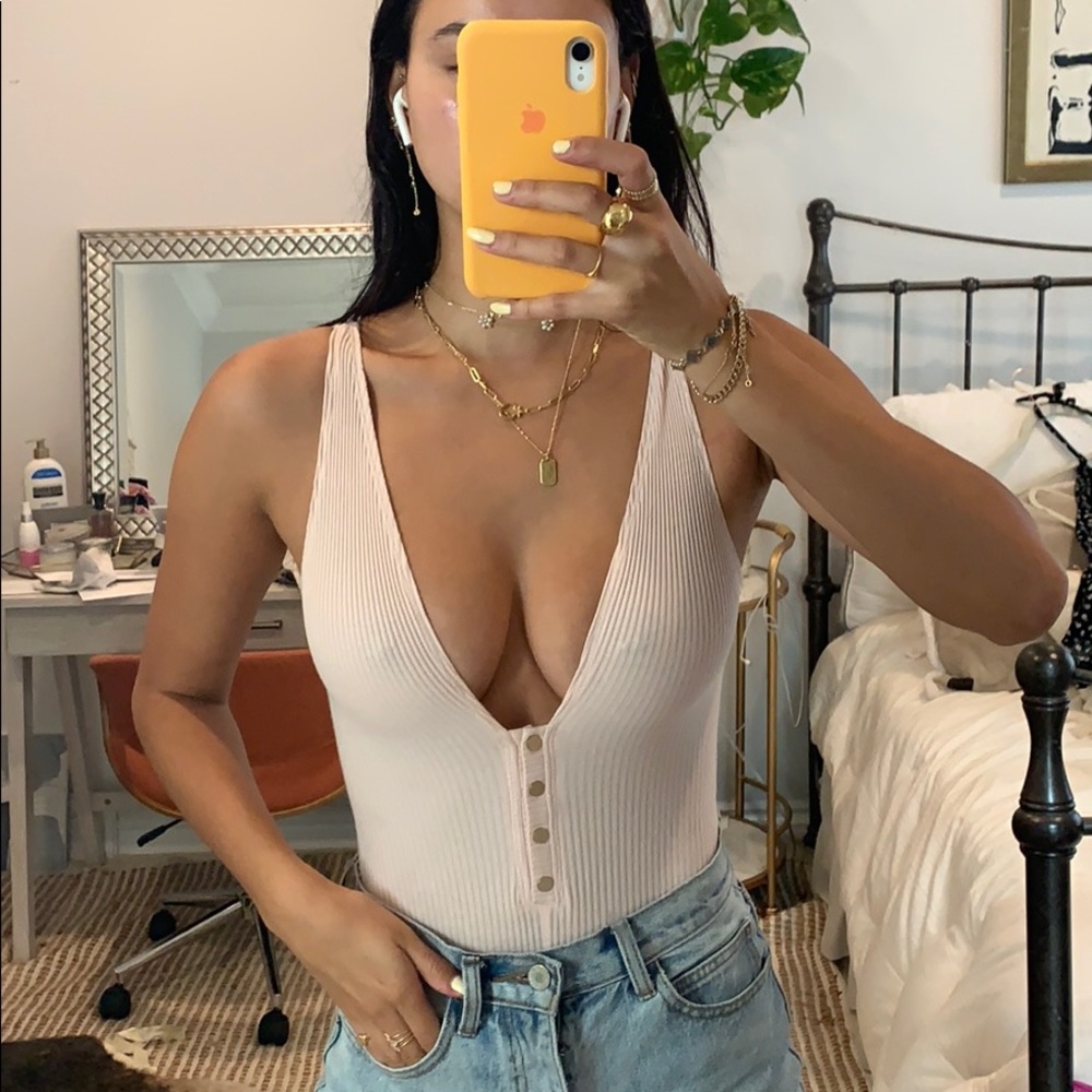 Baby pink button up body suit